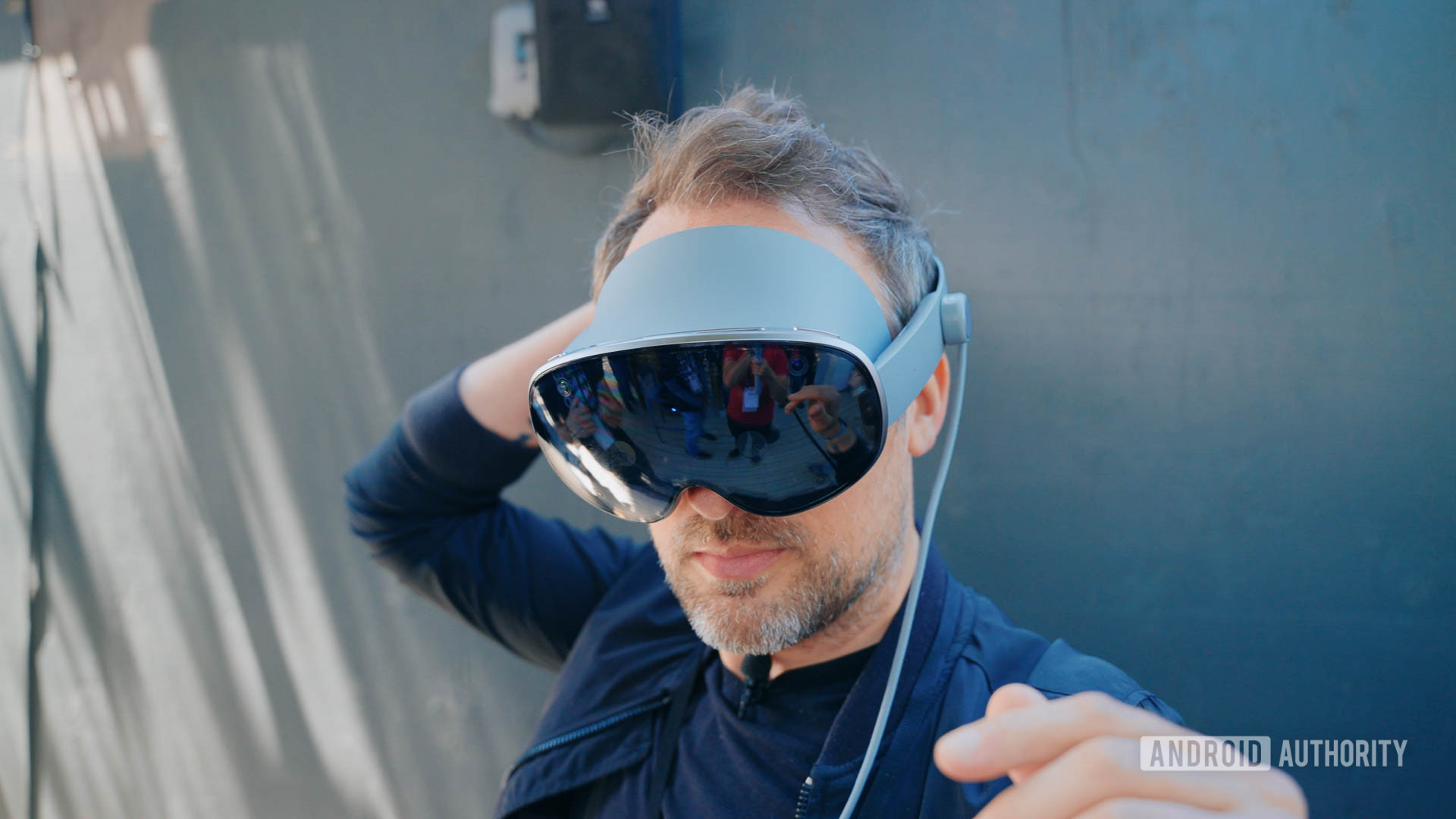 Google IO 2025 Project Moohan headset on man's head as he adjusts fit Google IO 2025 Project Moohan headset on man's head as he adjusts fit