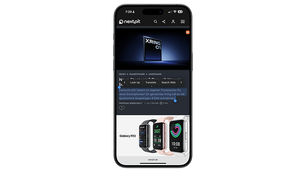 The mobile phone displays a web page with news and Google translation feature.