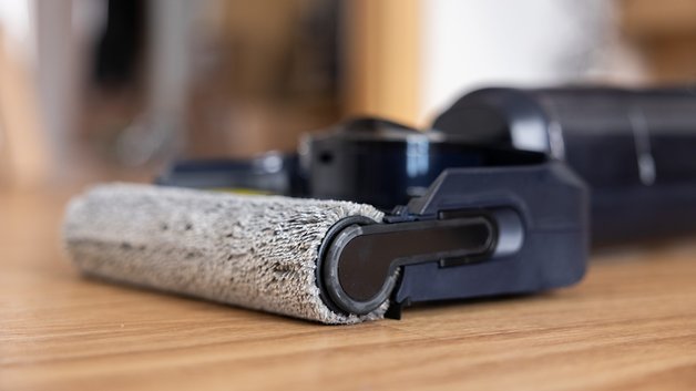 An close to the Tineco cleaning cylinder is one of the S7 vacuum cleaner on a wooden floor.